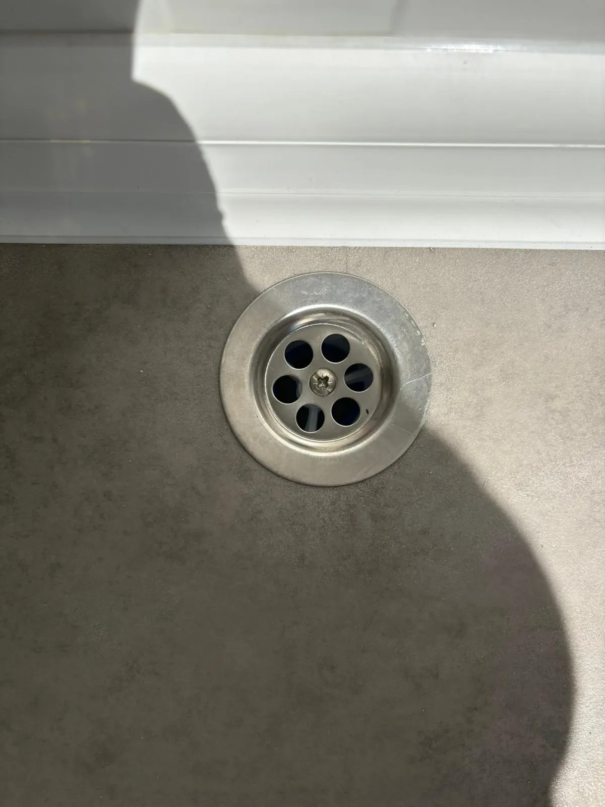 Floor drainage inside a portable bathroom unit.