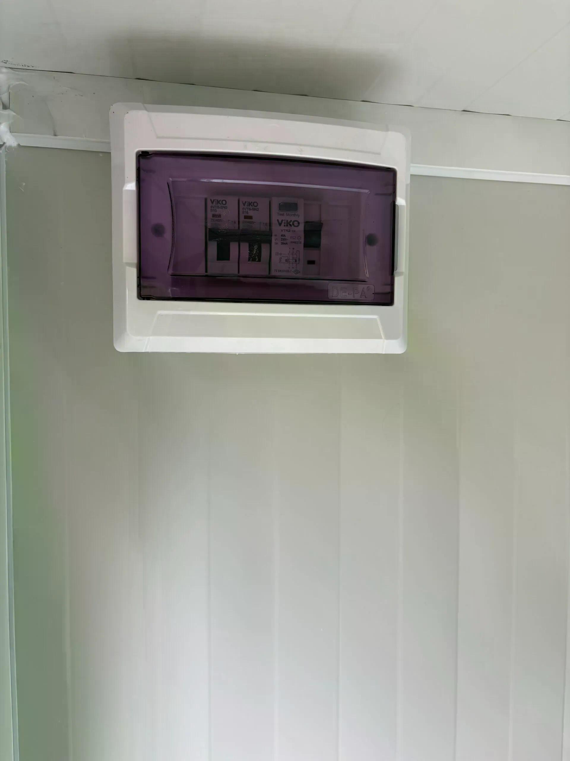 Fuse box inside a dual portable shower unit.