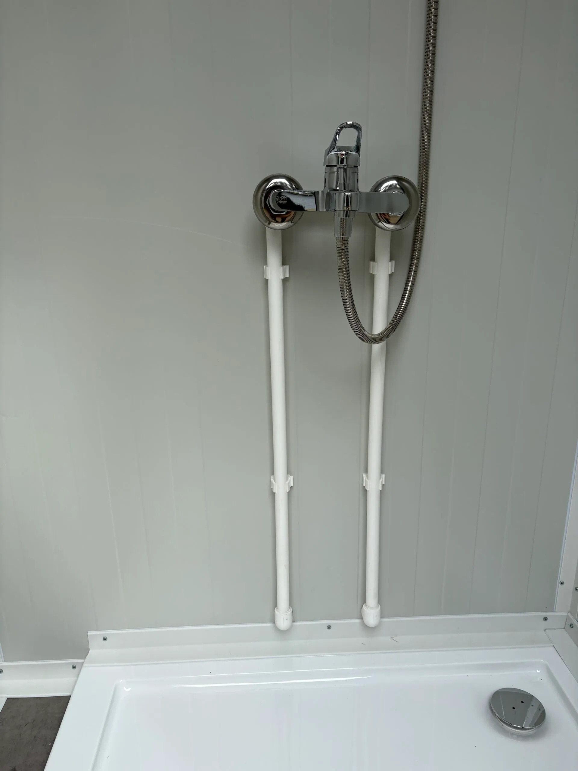 Interior close-up of a luxury portable shower unit for camping.
