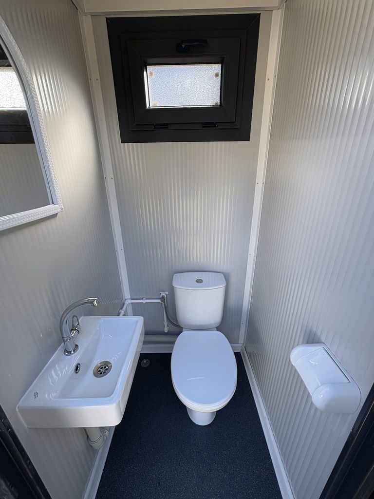 Interior close-up of a portable toilet unit for camping.
